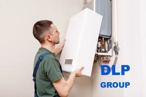 DLP Group heating engineer servicing a boiler.